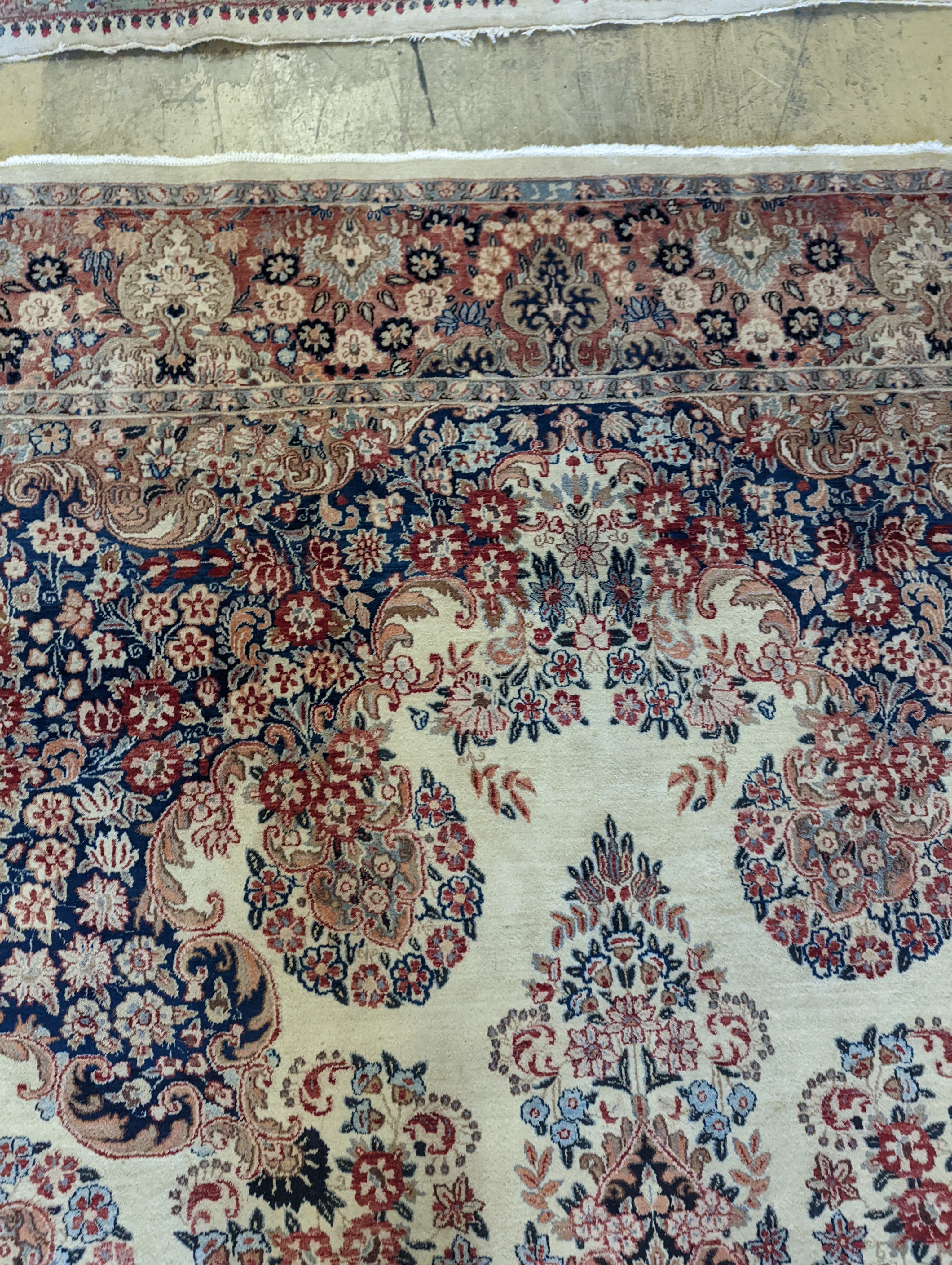 A North West Persian ivory ground carpet, 410 x 310cm